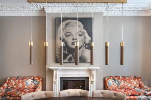 restored_historical_marble_fireplace_eclectic_sofas_